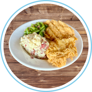 Chicken Fried Chicken at Cafe at athe Ridge on a white plate and wood background